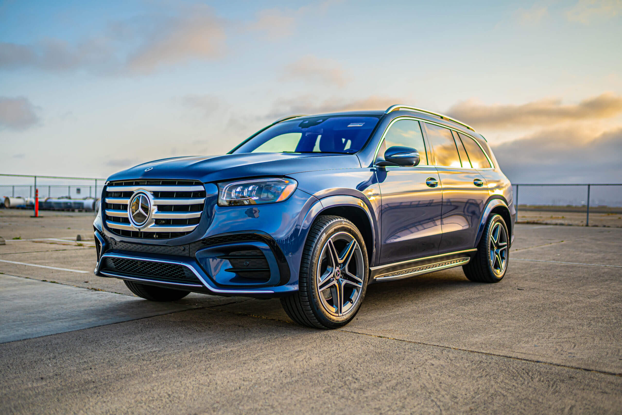 Front three-quarter view of a blue Mercedes-Benz GLS luxury SUV parked outdoors